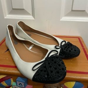cream with black studded toe slippers